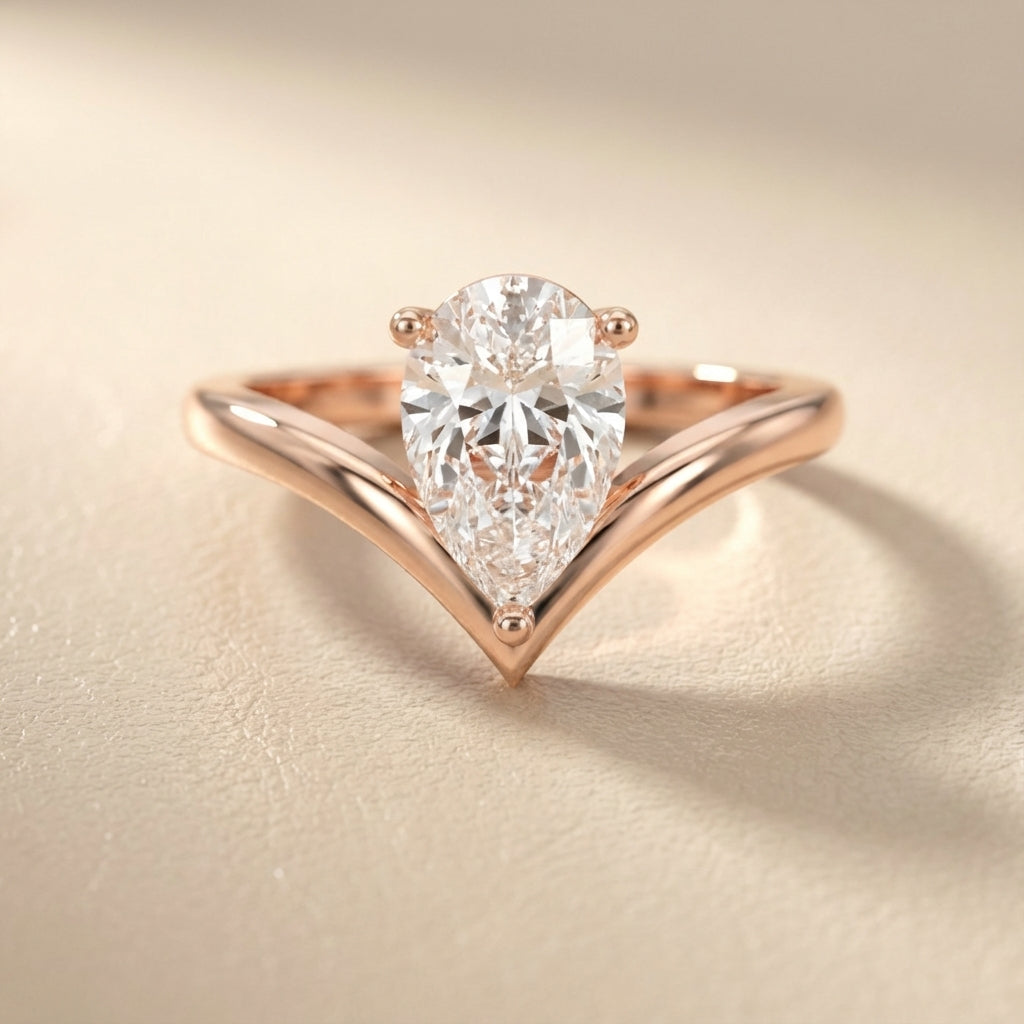 Pear Cut Lab Grown Diamond Chevron Solitaire Engagement Ring in Rose Gold