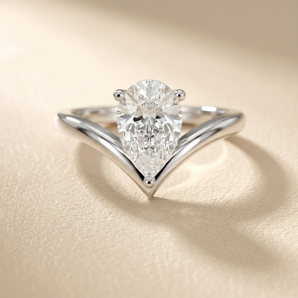 Pear Cut Lab Grown Diamond Chevron Solitaire Engagement Ring in Platinum