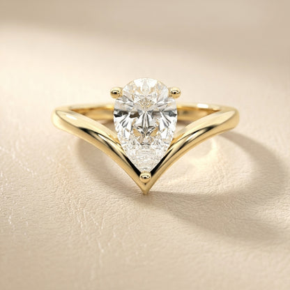 Pear Cut Lab Grown Diamond Chevron Solitaire Engagement Ring in Yellow Gold