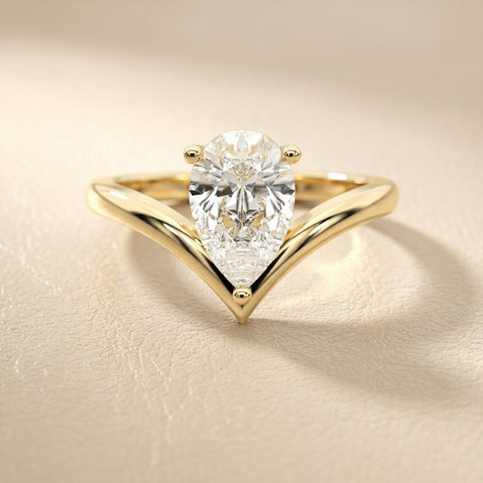 Pear Cut Lab Grown Diamond Chevron Solitaire Engagement Ring in Yellow Gold