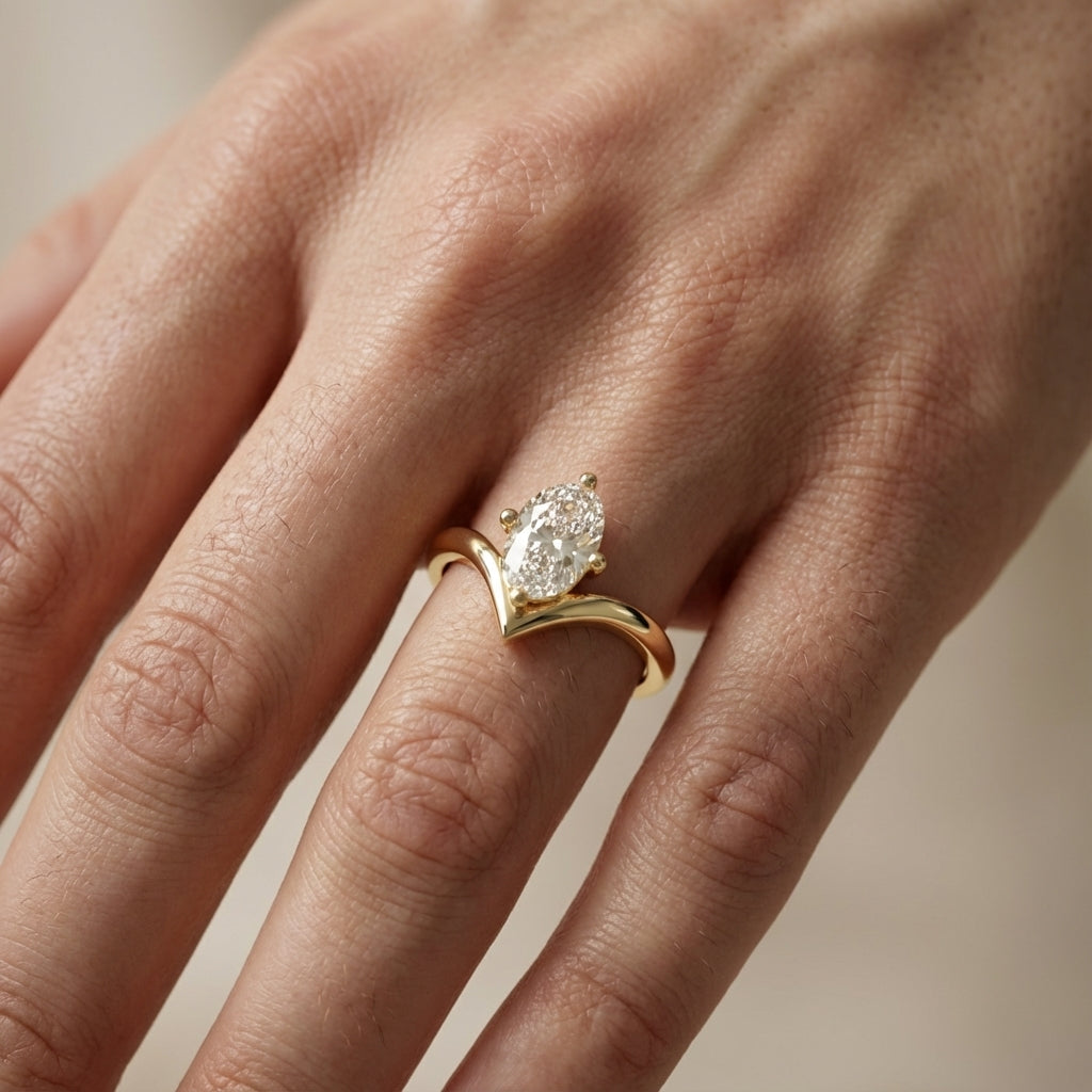 Oval Cut Lab Grown Diamond Chevron Solitaire Engagement Ring in Yellow Gold