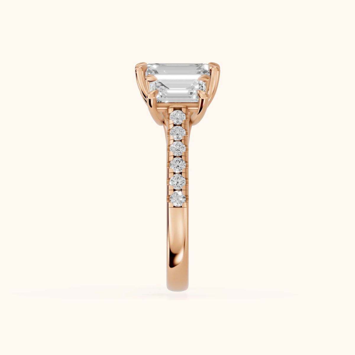 Gabrielle Three-Stone Pavé Emerald Diamond Engagement Ring in Rose Gold - SideView.webp