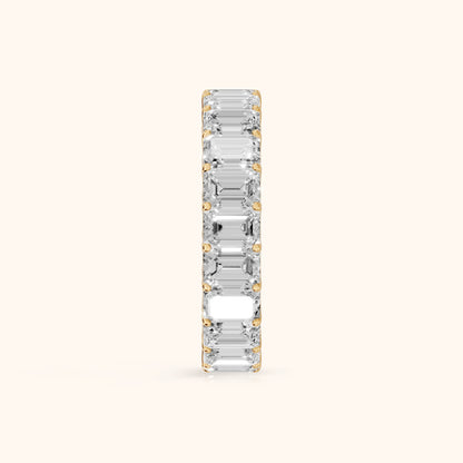 Josette Shared Prong Emerald Diamond Eternity Band in Yellow Gold - SideView