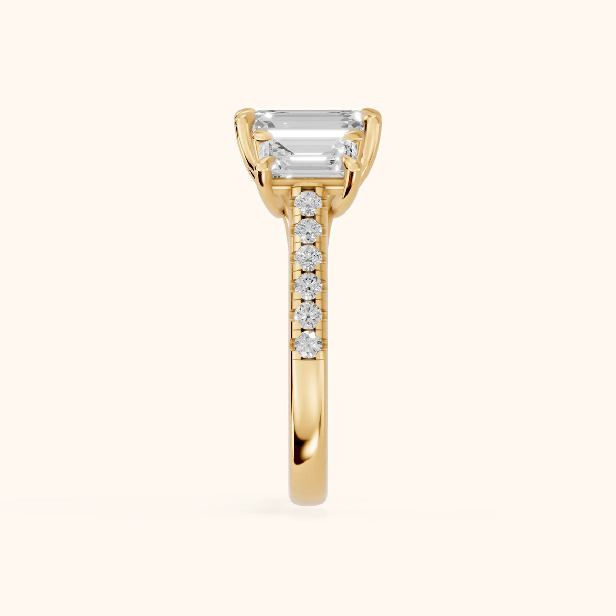 Gabrielle Three-Stone Pavé Emerald Diamond Engagement Ring in Yellow Gold - SideView.webp