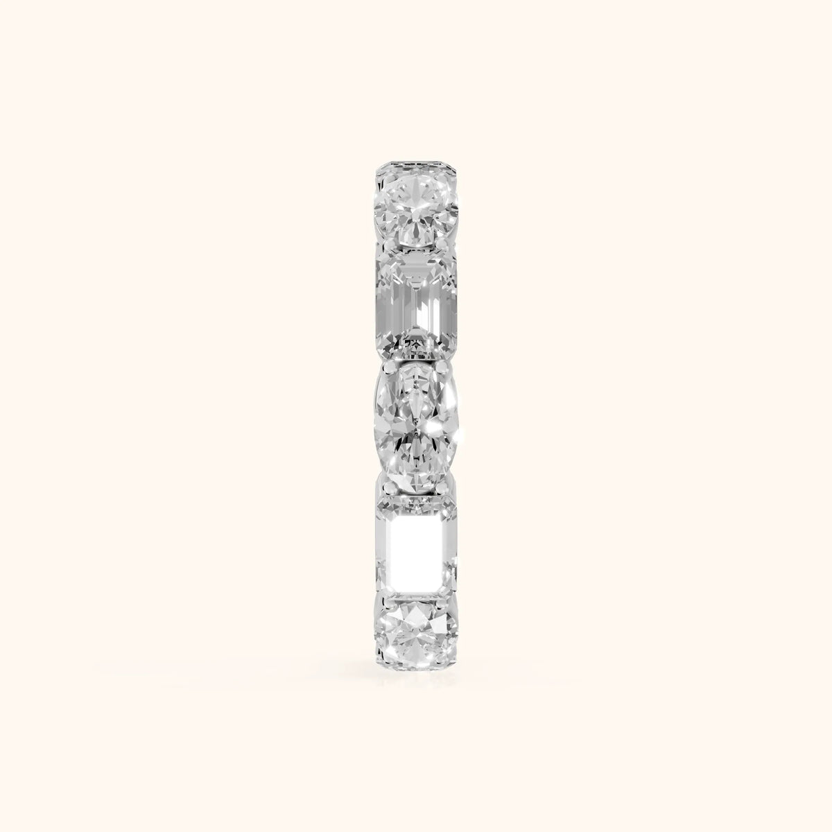 Hema Shared Prong Emerald & Oval Diamond Eternity Band in Platinum - SideView