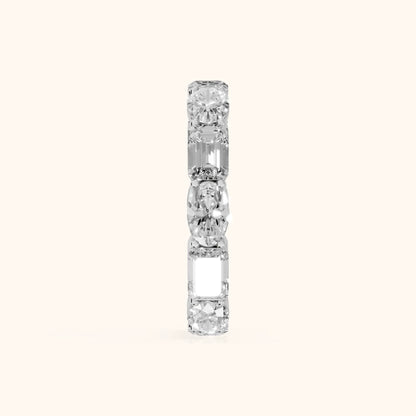 Hema Shared Prong Emerald & Oval Diamond Eternity Band in Platinum - SideView