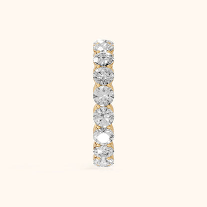 Dara Shared Prong Round Diamond Eternity Band in Yellow Gold - SideView
