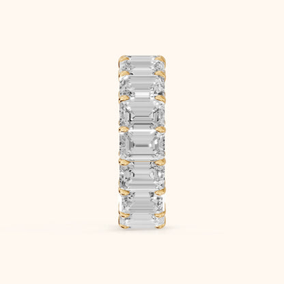 Zia Shared Prong Emerald Diamond Eternity Band in Yellow Gold - SideView