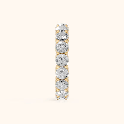 Camille Shared Prong Round Diamond Eternity Band in Yellow Gold - SideView