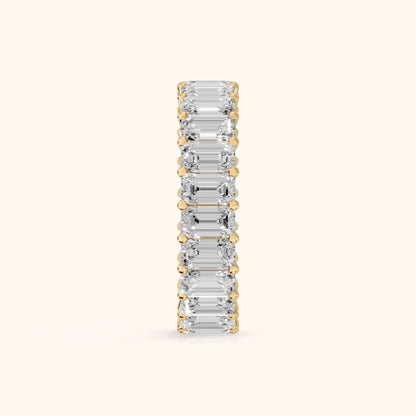 Callia Shared Prong Emerald Diamond Eternity Band in Yellow Gold - SideView