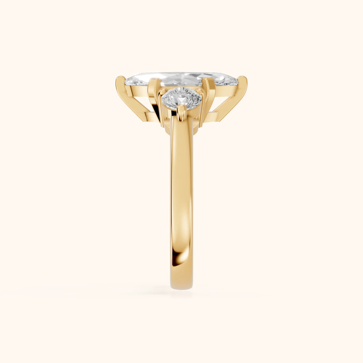 Freesia Three-Stone Marquise Diamond Engagement Ring in Yellow Gold - SideView.webp