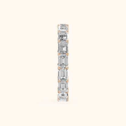 Ria East-West Emerald Diamond Eternity Band in Rose Gold - SideView