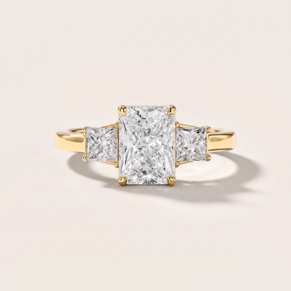 Aria Three-Stone Basket Radiant Diamond Engagement Ring in Yellow Gold [studio-metal-r8-20261024]