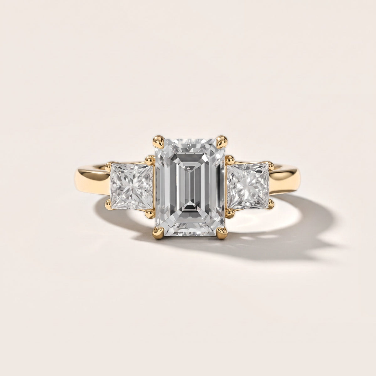 Sienna Three-Stone Emerald Diamond Engagement Ring in Yellow Gold [studio-metal-20261024]