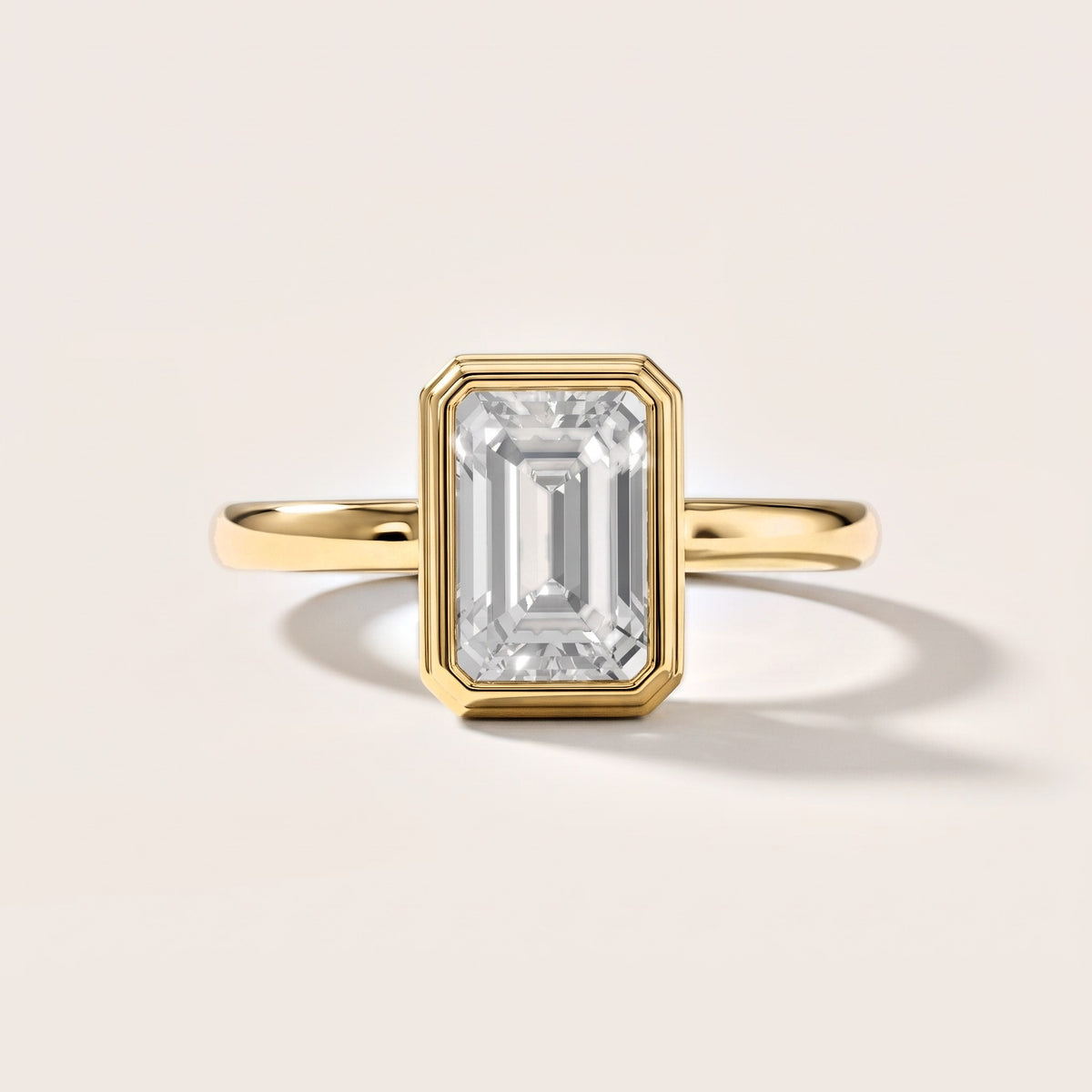 Maeve Bezel Solitaire Emerald Diamond Engagement Ring in Yellow Gold [studio-metal-20261024]