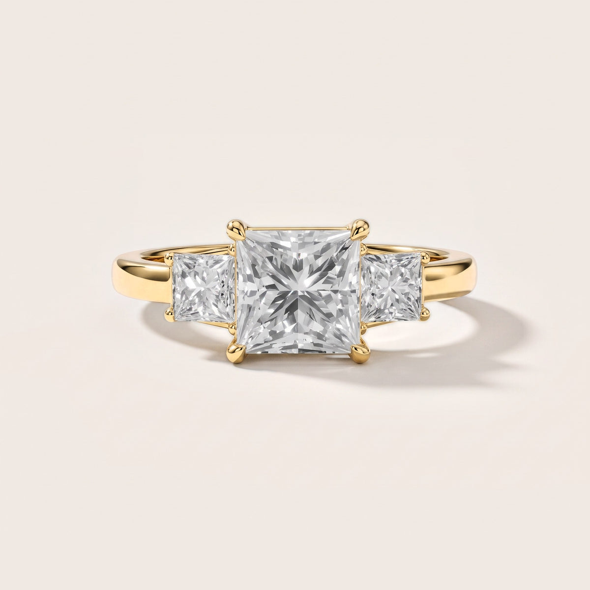Aria Three-Stone Basket Princess Diamond Engagement Ring in Yellow Gold [studio-metal-20261024]