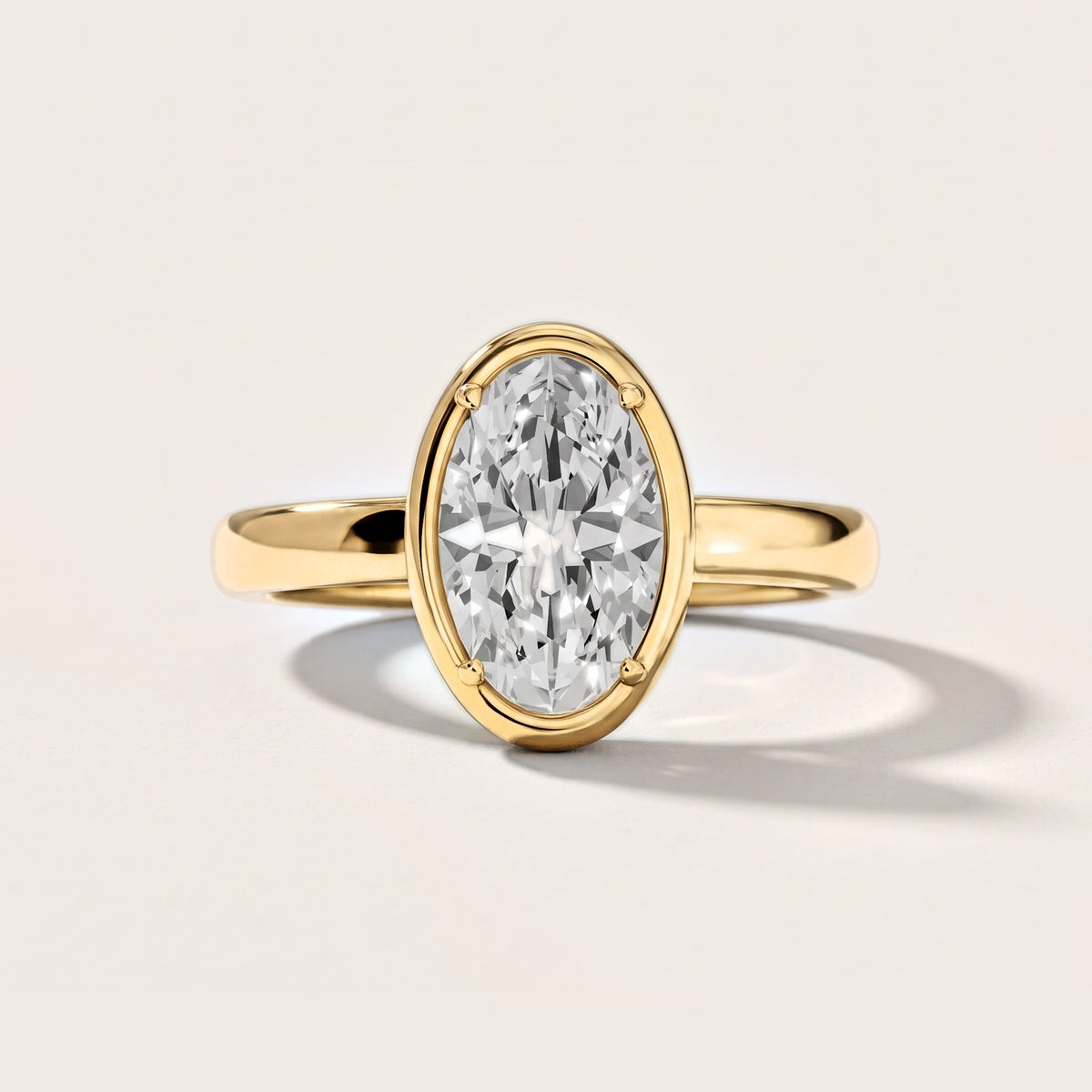 Alina Bezel Solitaire Oval Diamond Engagement Ring in Yellow Gold [studio-metal-20261024]