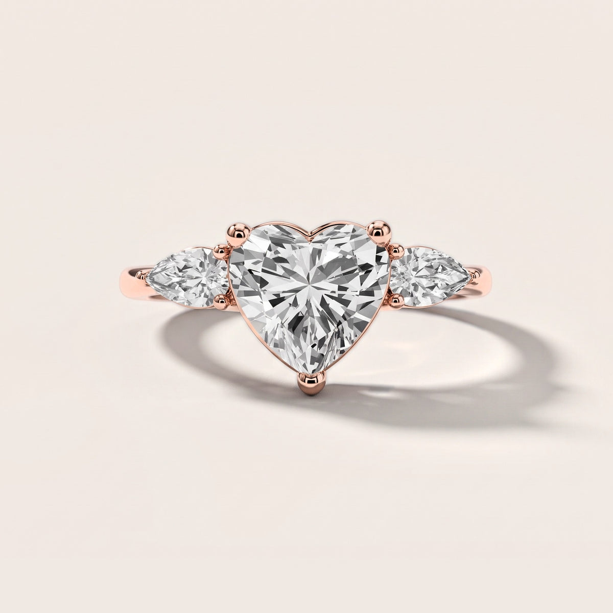 Faye Three-Stone Trellis Heart Diamond Engagement Ring in Rose Gold [studio-metal-20261024]