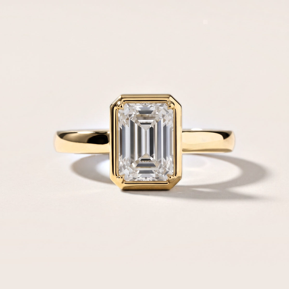 Alina Bezel Solitaire Emerald Diamond Engagement Ring in Yellow Gold [studio-metal-20261024]