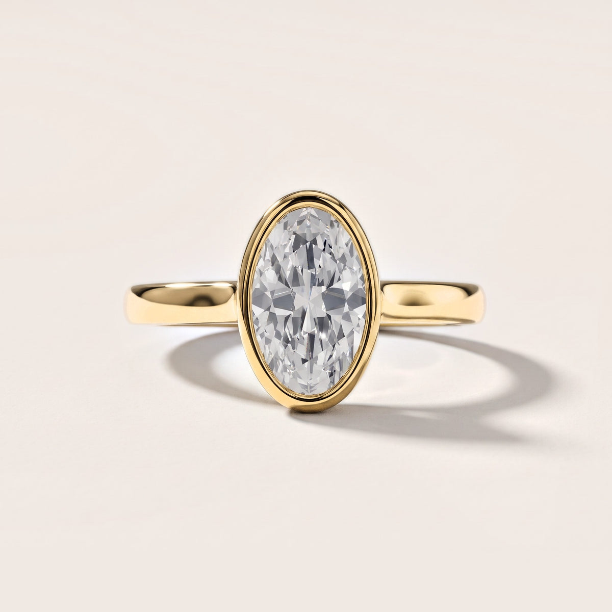 Jolie Bezel Solitaire Oval Diamond Engagement Ring in Yellow Gold [studio-metal-20261024]