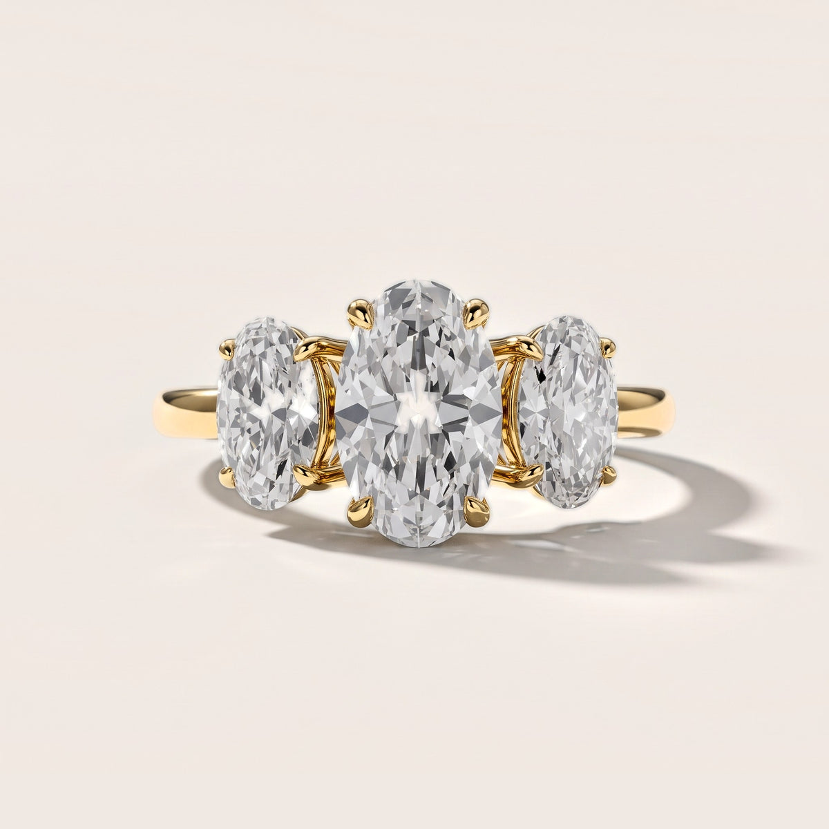 Lila Three-Stone Oval Diamond Engagement Ring in Yellow Gold [studio-metal-20261024]