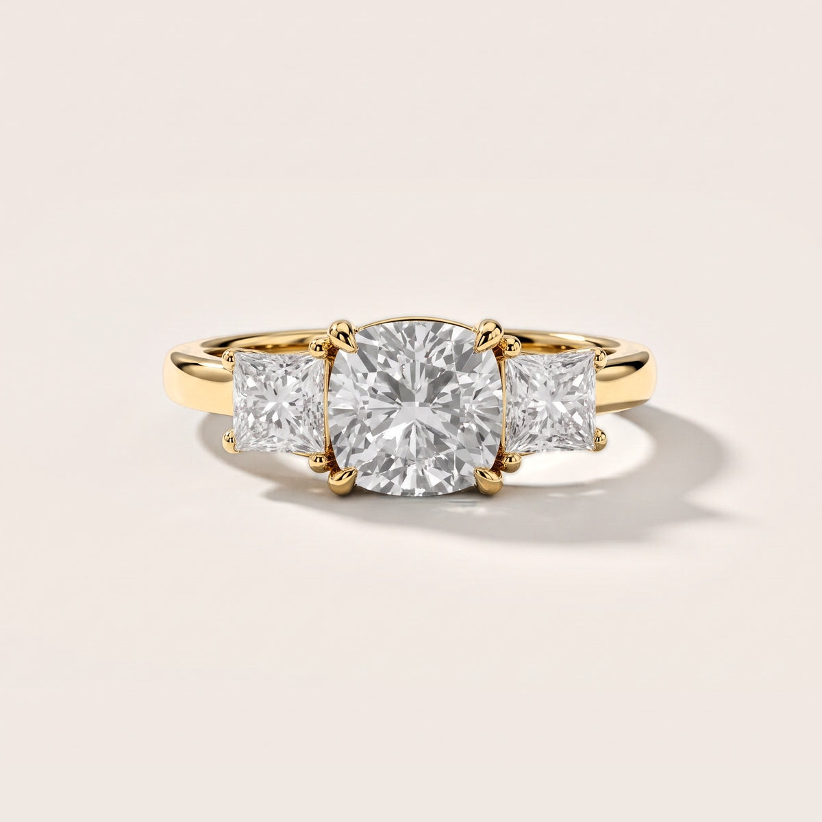 Sienna Three-Stone Cushion Diamond Engagement Ring in Yellow Gold [studio-metal-20261024]