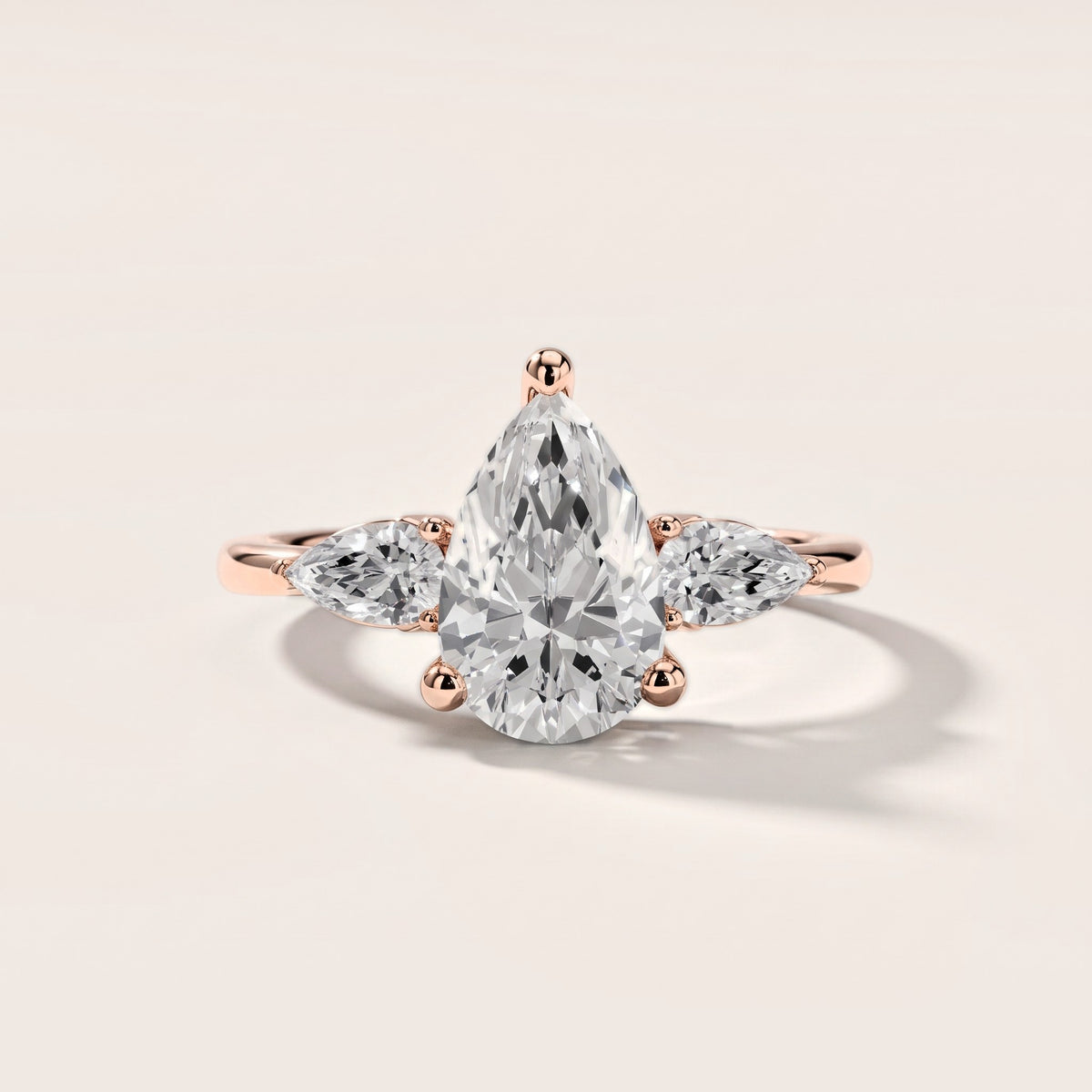 Faye Three-Stone Trellis Pear Diamond Engagement Ring in Rose Gold [studio-metal-20261024]