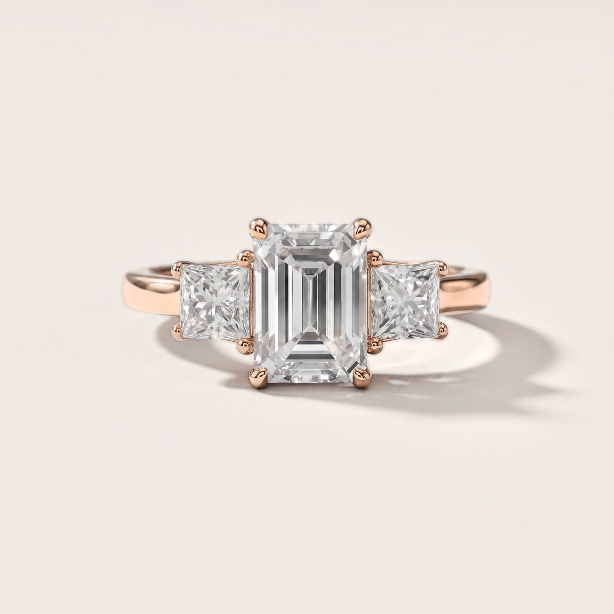 Sienna Three-Stone Emerald Diamond Engagement Ring in Rose Gold [studio-metal-20261024]