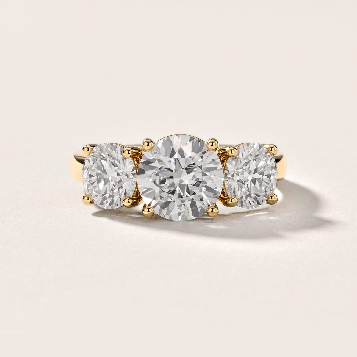 Esme Three-Stone Tapered Round Diamond Engagement Ring in Yellow Gold [studio-metal-20261024]