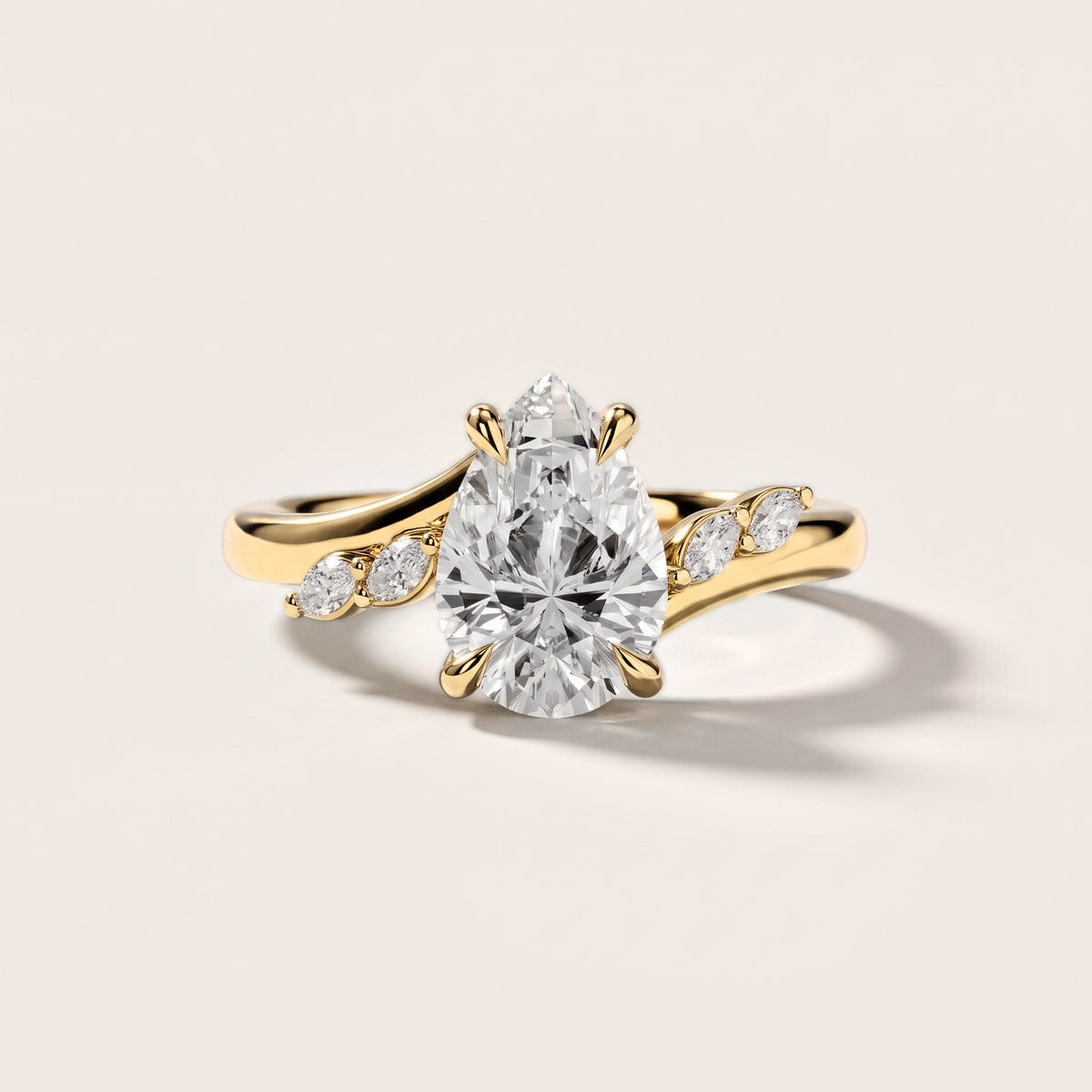 Flora Twist Side Stone Pear Diamond Engagement Ring in Yellow Gold [studio-metal-20261024]