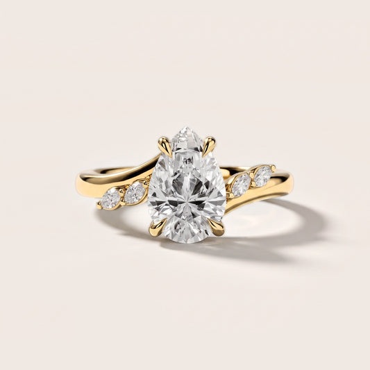 Flora Twist Side Stone Pear Diamond Engagement Ring in Yellow Gold [studio-metal-20261024]