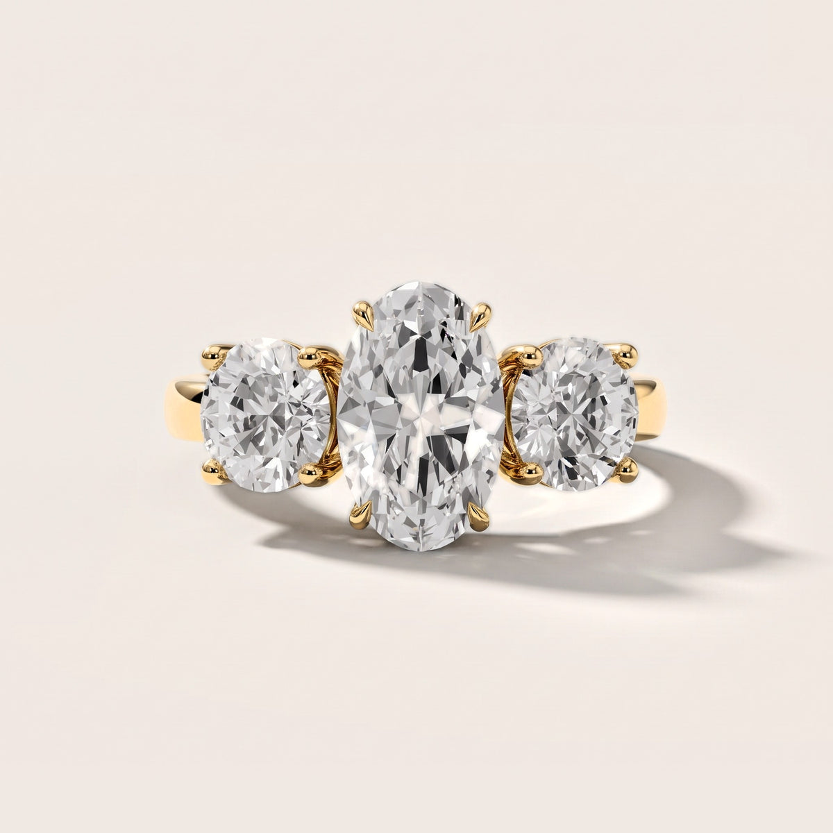 Esme Three-Stone Tapered Oval Diamond Engagement Ring in Yellow Gold [studio-metal-20261024]