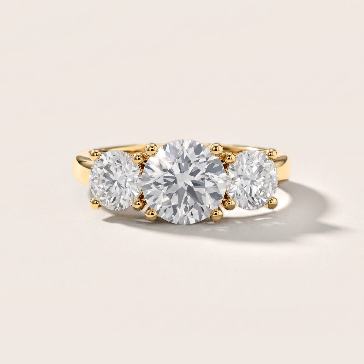 Callie Three-Stone Trellis Round Diamond Engagement Ring in Yellow Gold [studio-metal-20261024]