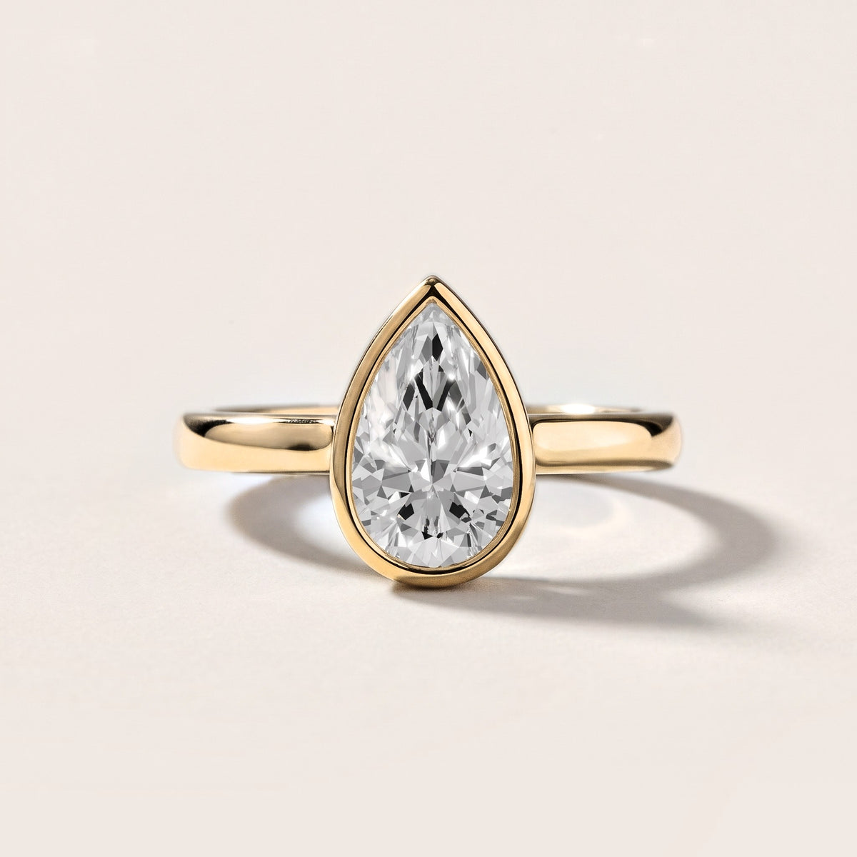 Jolie Bezel Solitaire Pear Diamond Engagement Ring in Yellow Gold [studio-metal-20261024]