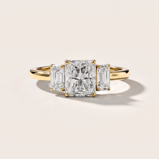 Marian Three-Stone Hidden Halo Radiant Diamond Engagement Ring in Yellow Gold [studio-metal-20261024]