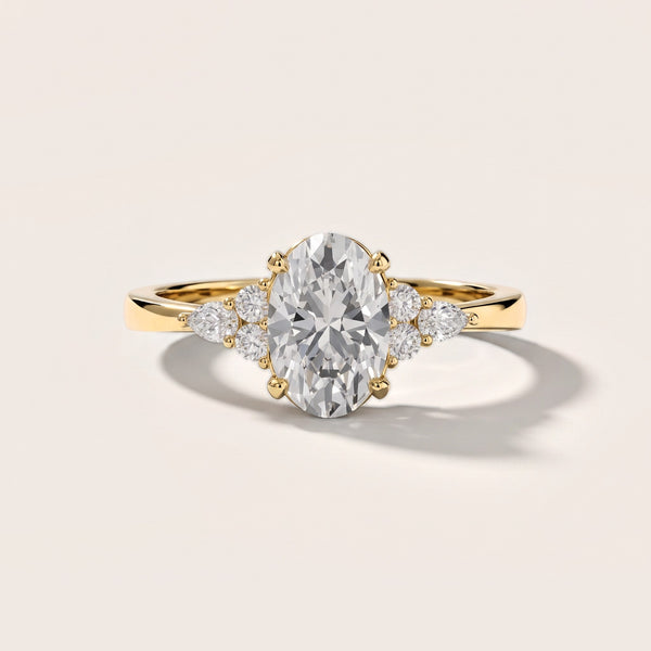 Amelia Three Stone Oval Diamond Engagement Ring in Yellow Gold