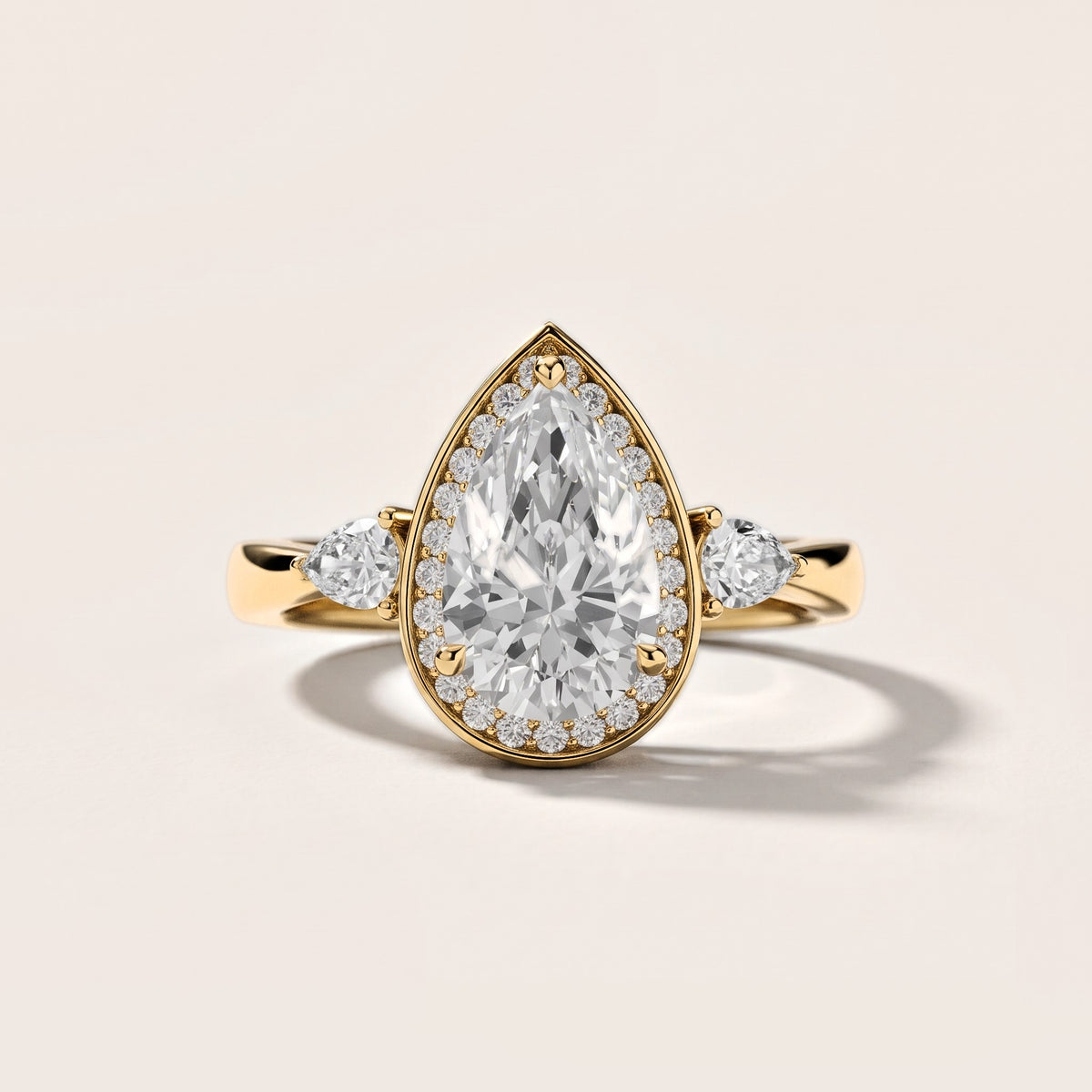 Eliza Halo Sidestone Pear Diamond Engagement Ring in Yellow Gold [studio-metal-20261024]