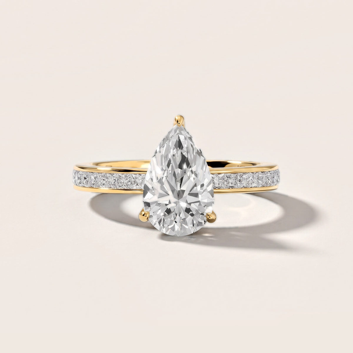 Brielle Channel Set Solitaire Pear Diamond Engagement Ring in Yellow Gold [studio-metal-20261024]
