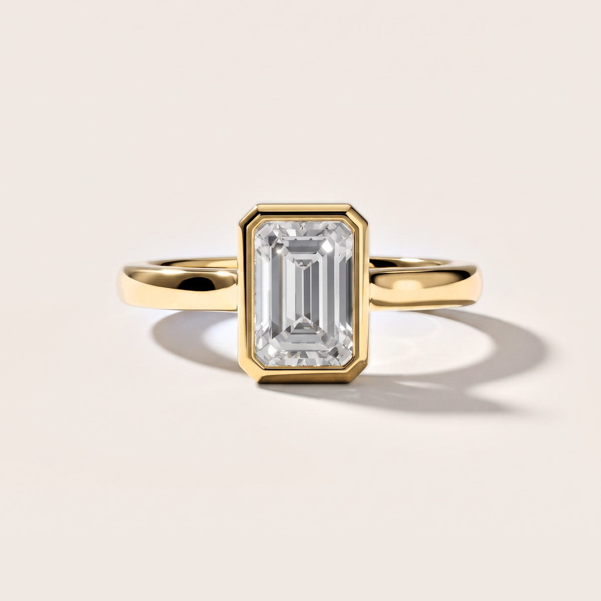 Jolie Bezel Solitaire Emerald Diamond Engagement Ring in Yellow Gold [studio-metal-20261024]