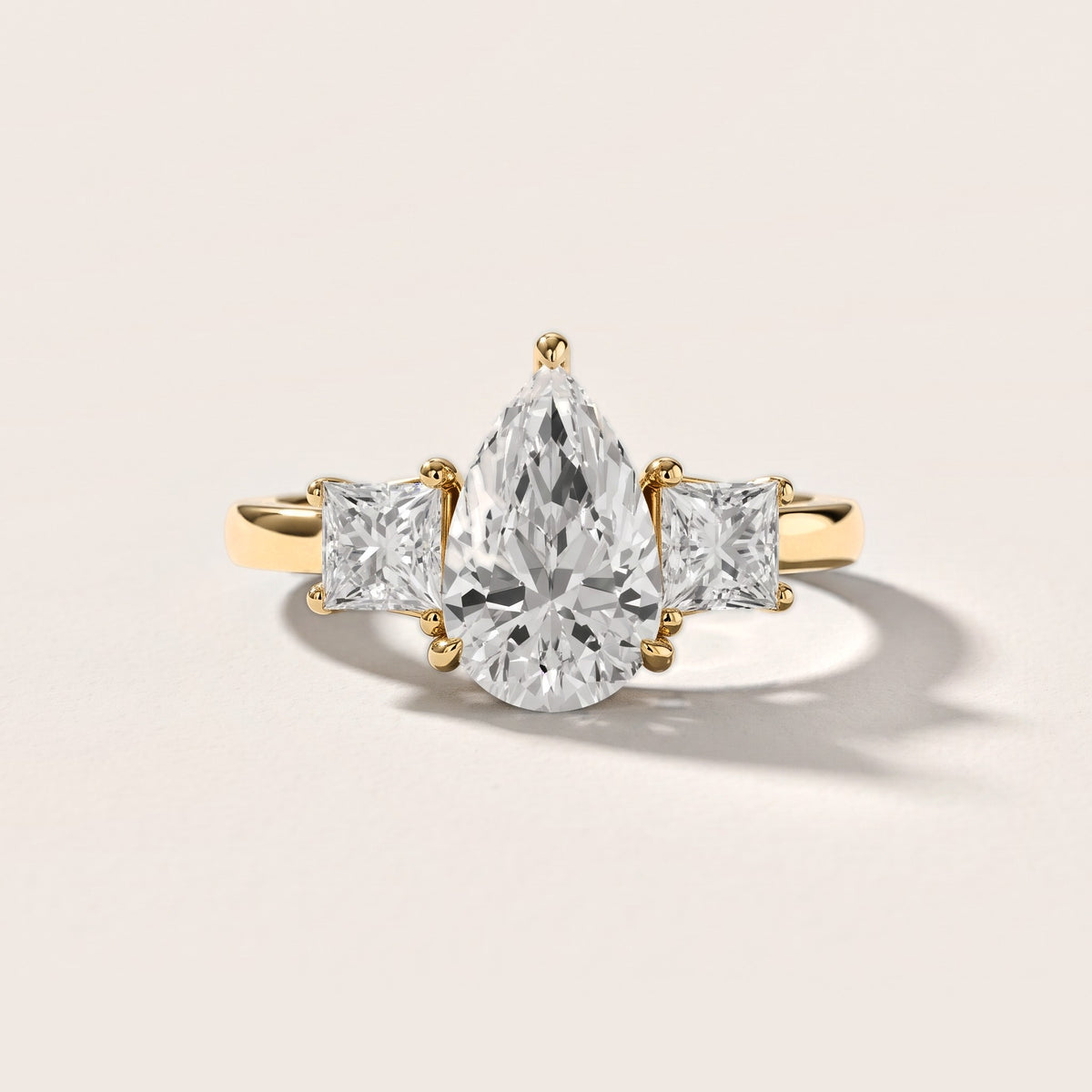 Sienna Three-Stone Pear Diamond Engagement Ring in Yellow Gold [studio-metal-20261024]