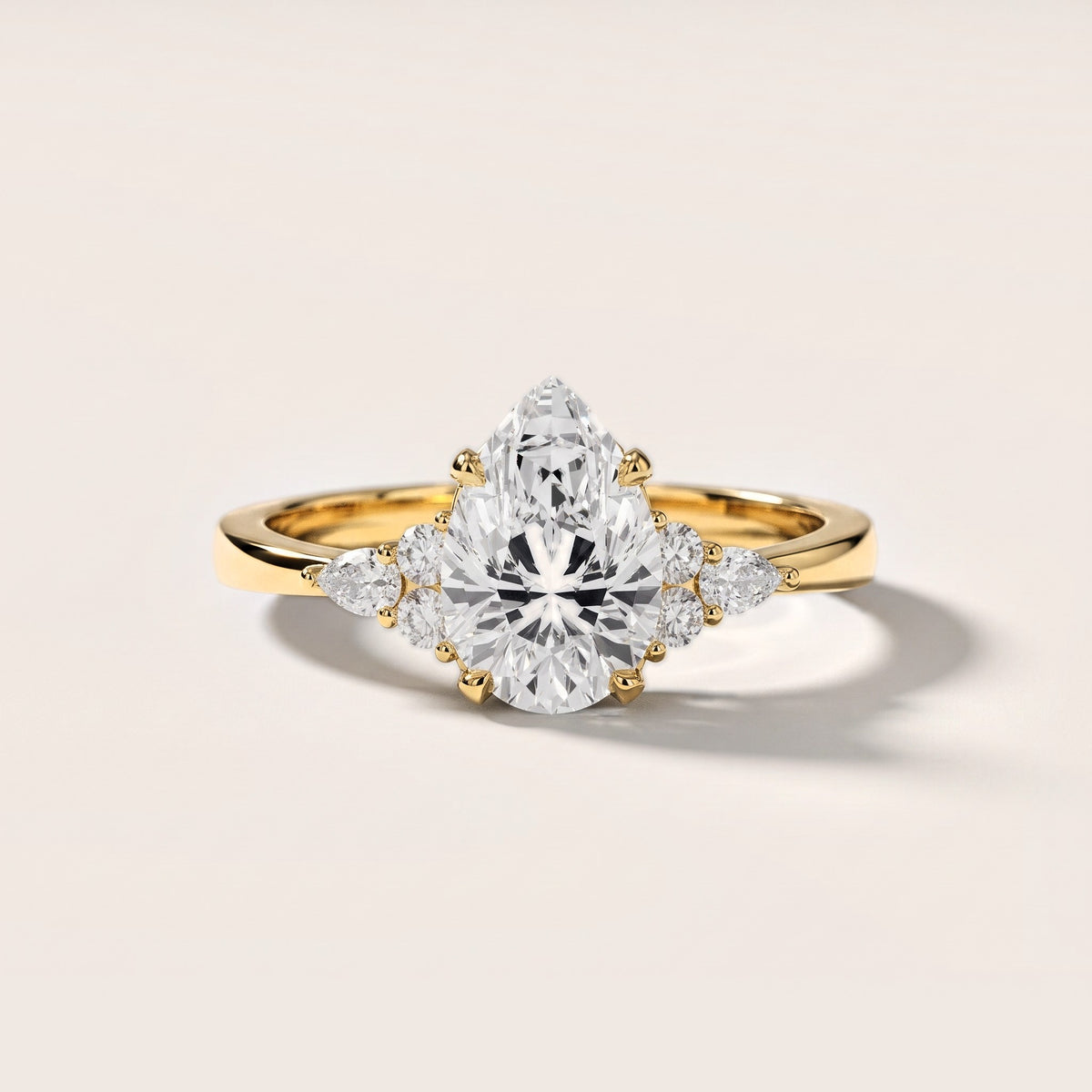 Amelia Three Stone Pear Diamond Engagement Ring in Yellow Gold [studio-metal-20261024]