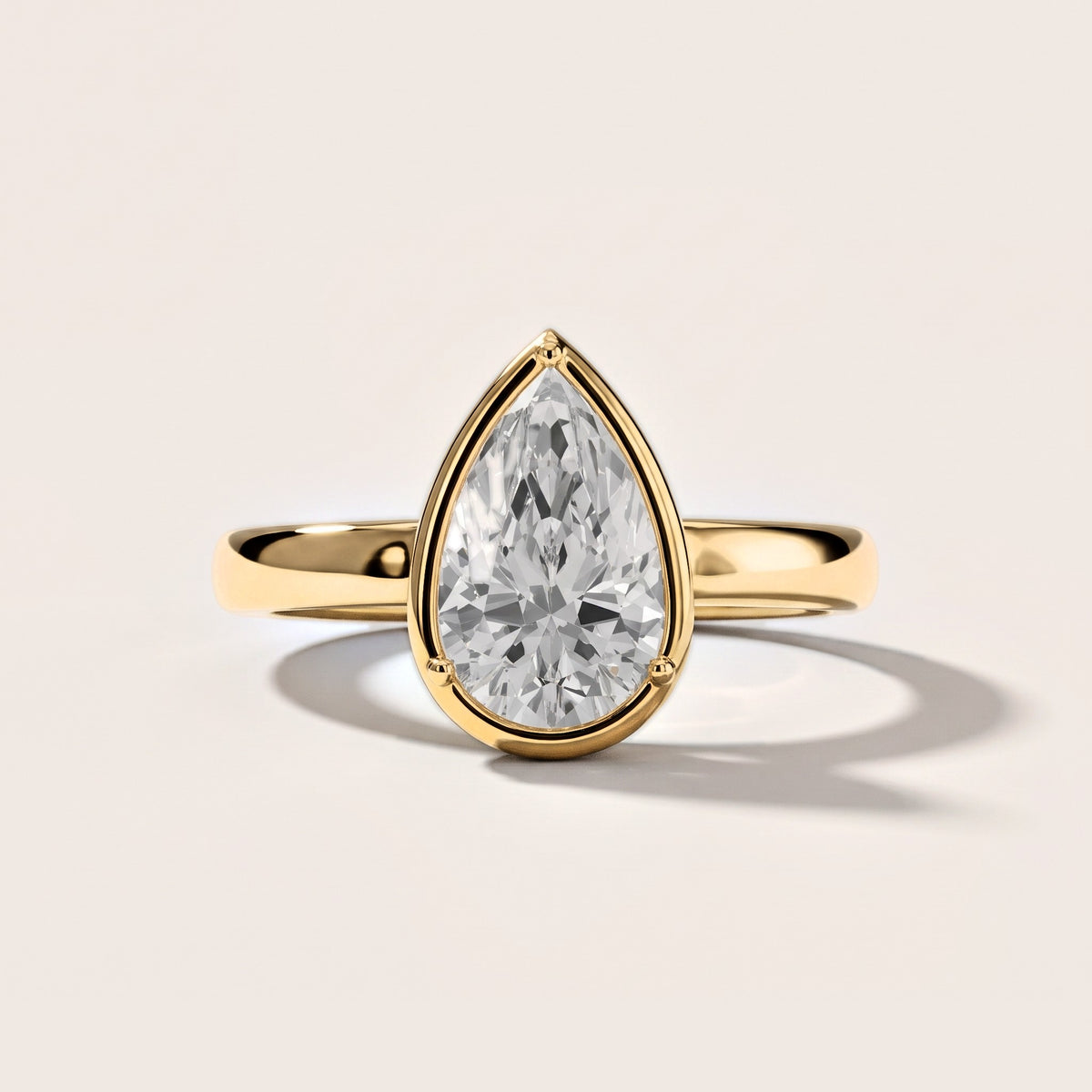Alina Bezel Solitaire Pear Diamond Engagement Ring in Yellow Gold [studio-metal-20261024]
