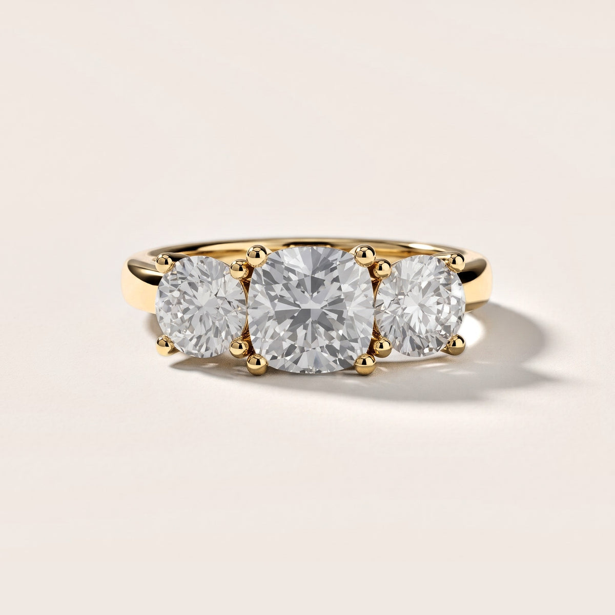 Callie Three-Stone Trellis Cushion Diamond Engagement Ring in Yellow Gold [studio-metal-20261024]