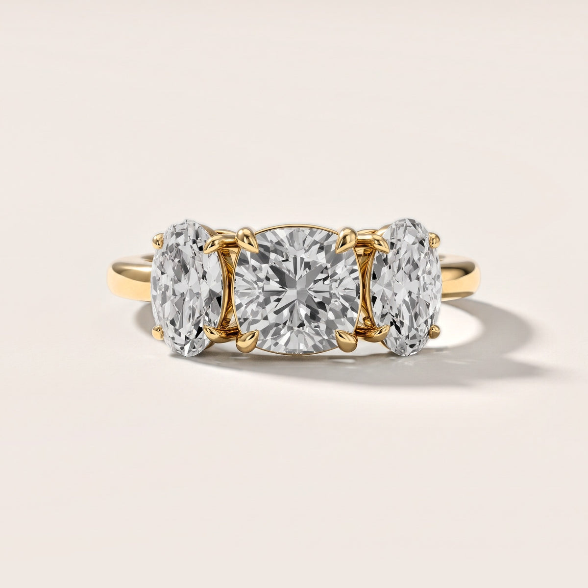 Lila Three-Stone Cushion Diamond Engagement Ring in Yellow Gold [studio-metal-20261024]