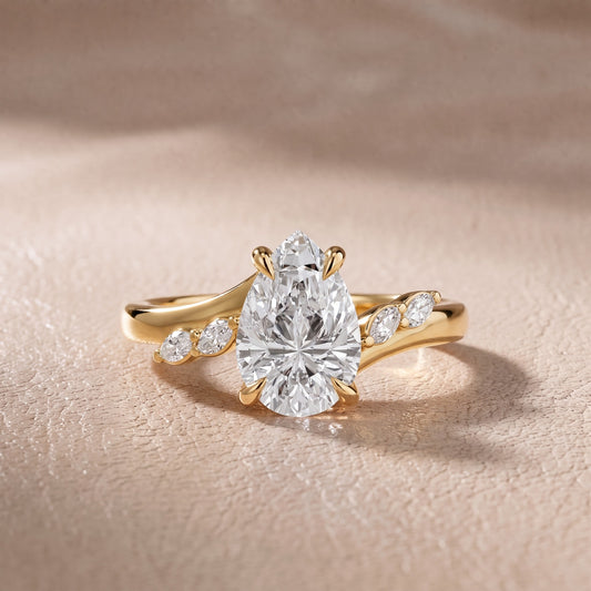 Flora Twist Side Stone Pear Diamond Engagement Ring in Yellow Gold - front.jpg