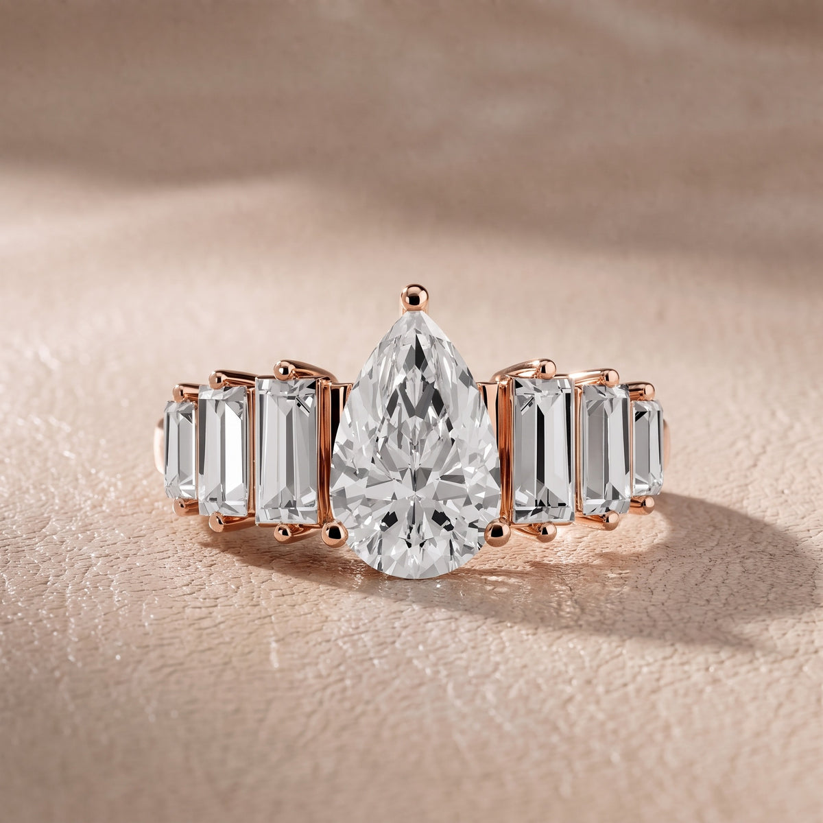 Mara Sidestone Baguette Accent Pear Diamond Engagement Ring in Rose Gold - front.jpg