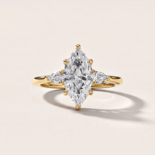 Leila Three-Stone Marquise Diamond Engagement Ring in Yellow Gold