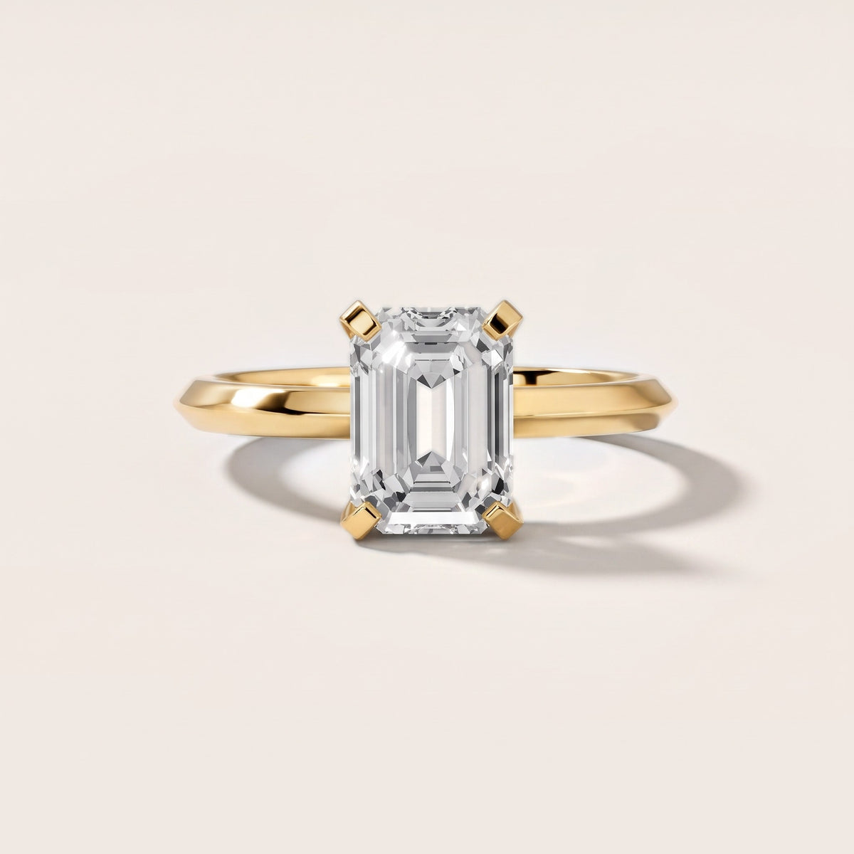 Verity Solitaire Knife Edge Emerald Diamond Engagement Ring in Yellow Gold - front.jpg