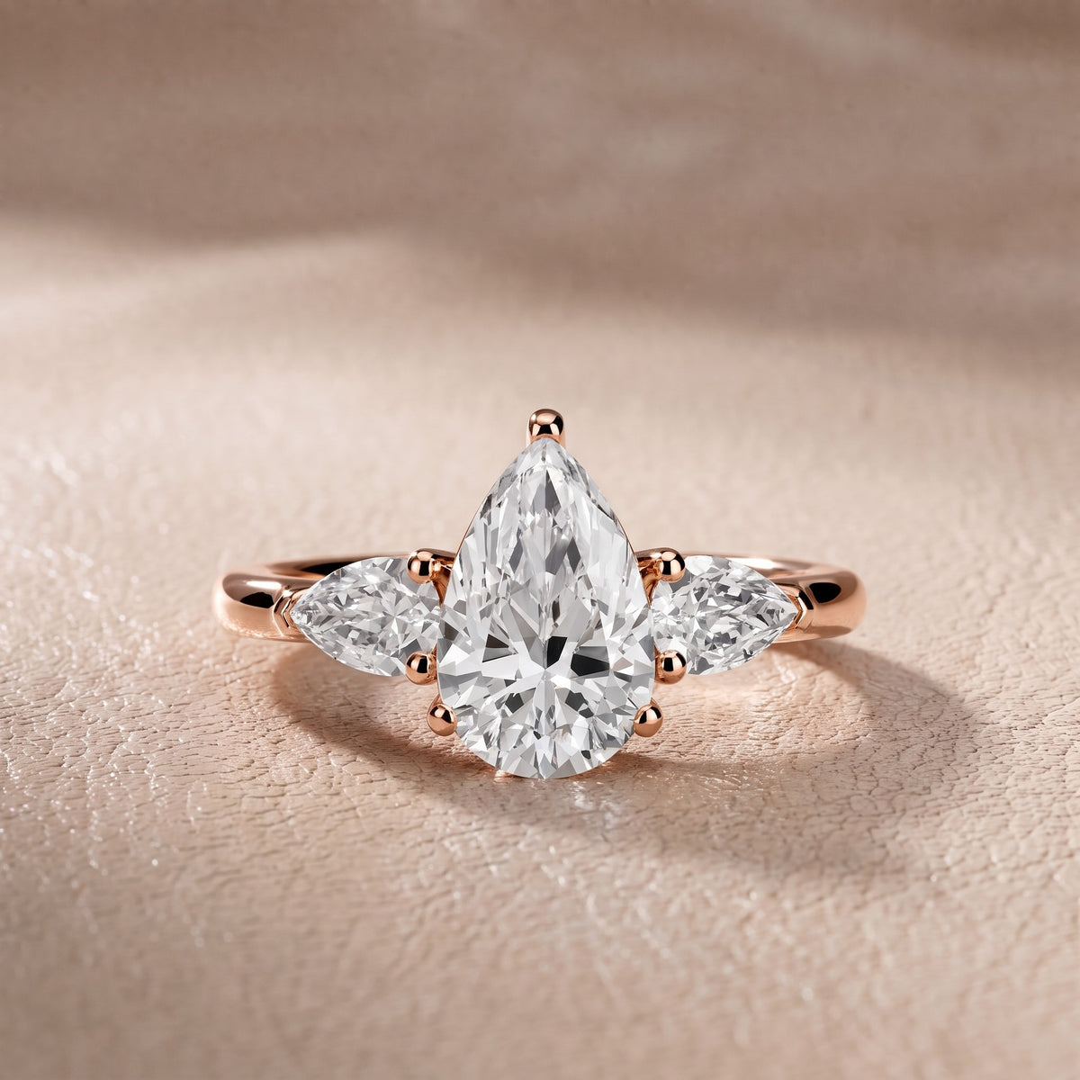 Sophia Three-Stone Pear Diamond Engagement Ring in Rose Gold - front.jpg