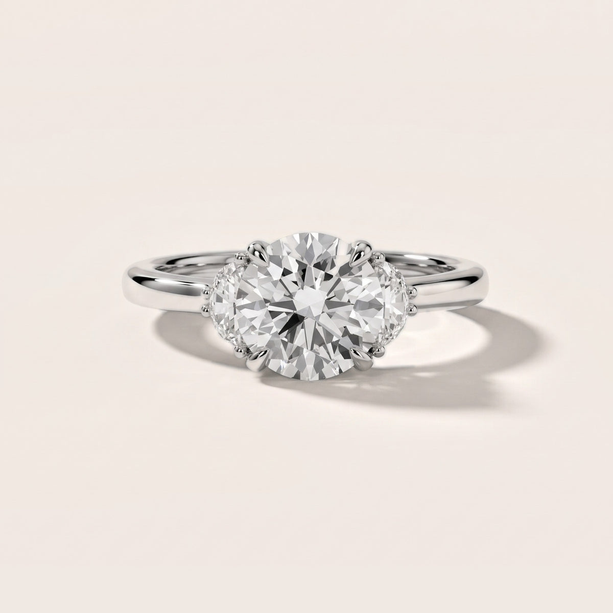 Geneva Half-Moon Three-Stone Round Diamond Engagement Ring in Platinum - front.jpg
